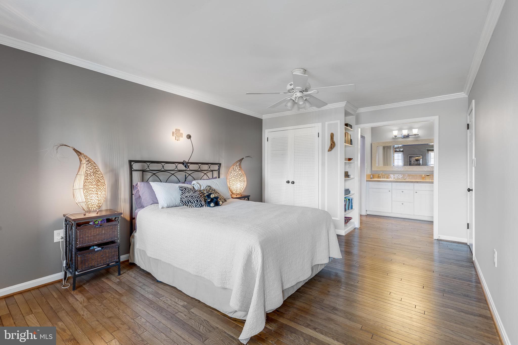 1700 Chester Mill Road Silver Spring, MD 20906 - Photo 19 of 53 a bedroom with a bed and a chandelier