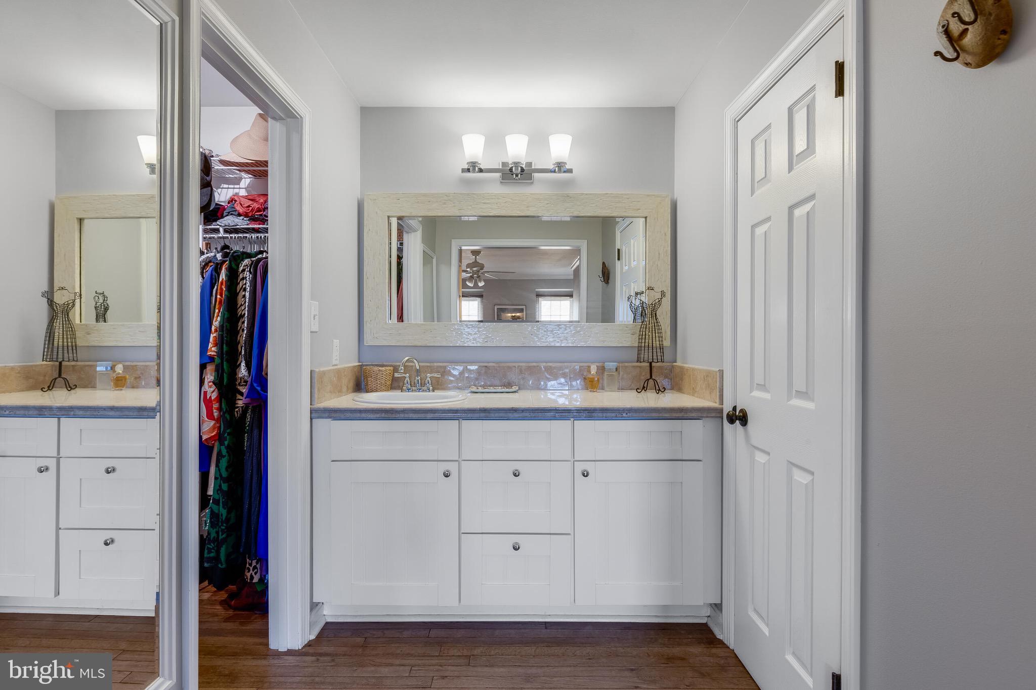 1700 Chester Mill Road Silver Spring, MD 20906 - Photo 20 of 53 a bathroom with a sink and a mirror