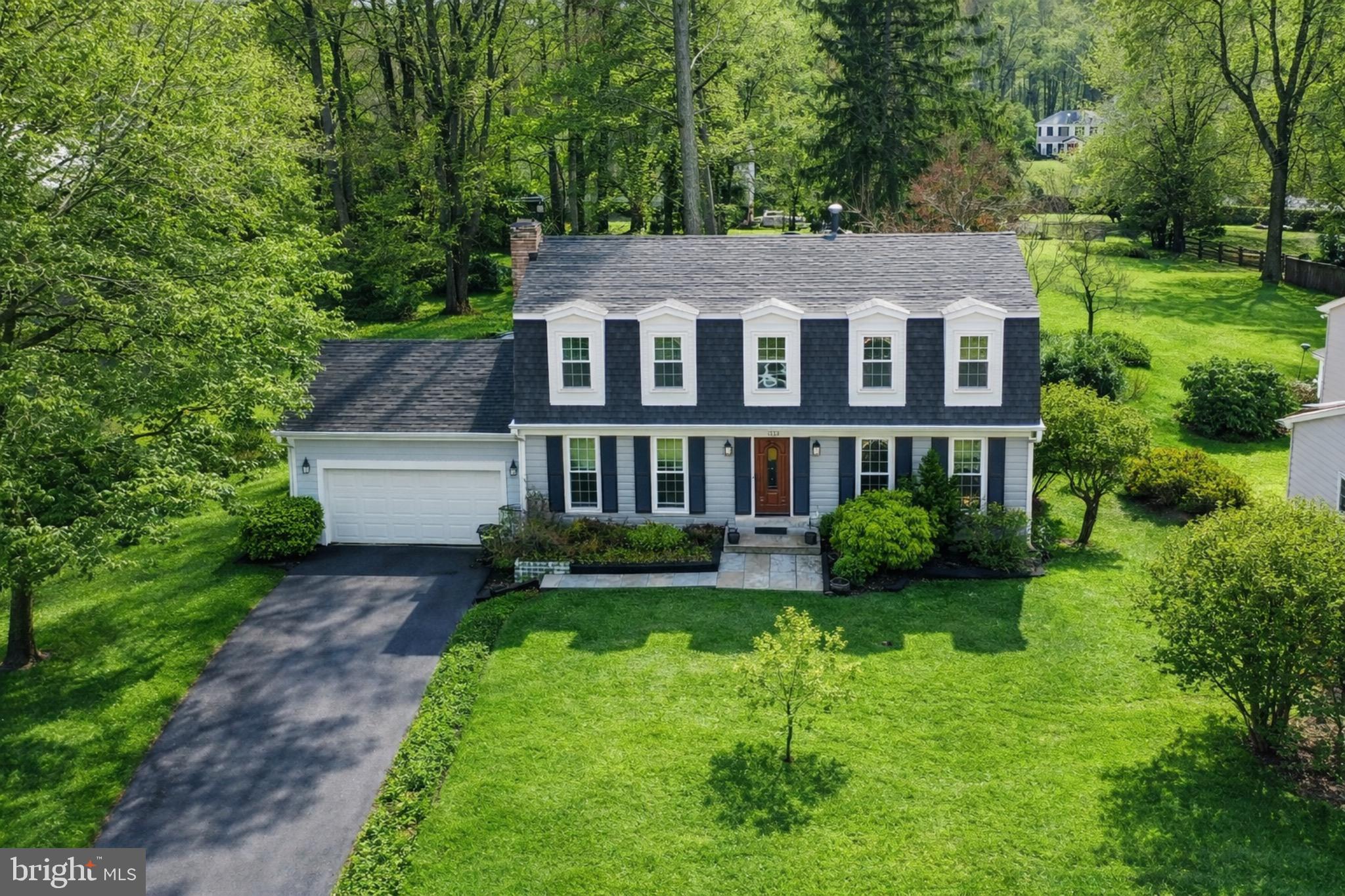 1700 Chester Mill Road Silver Spring, MD 20906 - Photo 42 of 53 a aerial view of a house next to a big yard and large trees