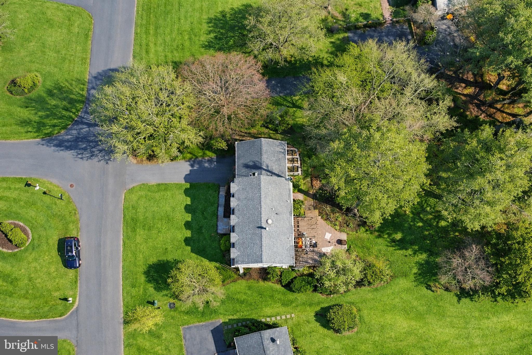 1700 Chester Mill Road Silver Spring, MD 20906 - Photo 47 of 53 an aerial view of a house with a yard and large trees