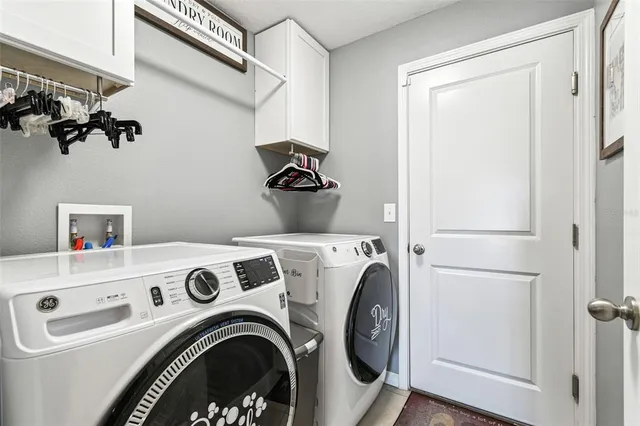 a kitchen with stainless steel appliances granite countertop a refrigerator stove microwave and sink