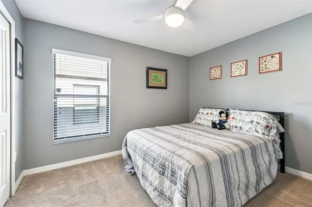 a view of a hallway with wooden shelves