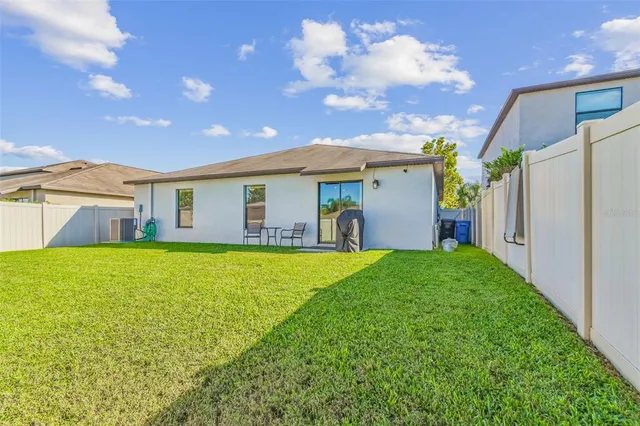 a front view of house with yard and outdoor seating