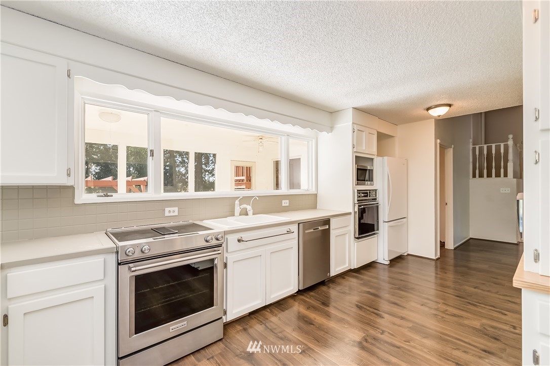 3367 Clearbrook Road Sumas, WA 98295 - Photo 13 of 25 a kitchen with stainless steel appliances granite countertop a stove and a sink