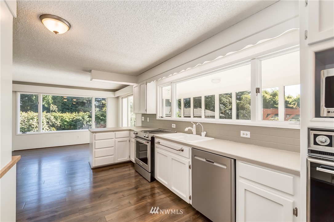 3367 Clearbrook Road Sumas, WA 98295 - Photo 14 of 25 a open kitchen with stainless steel appliances granite countertop a stove and a large window