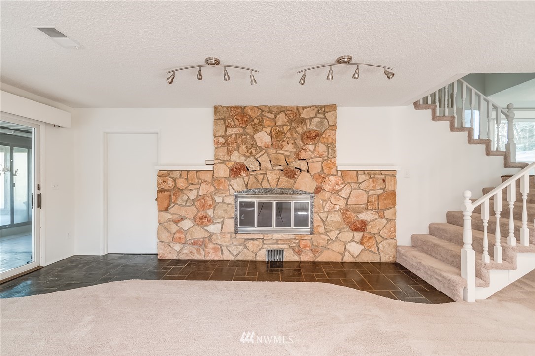 3367 Clearbrook Road Sumas, WA 98295 - Photo 20 of 25 a view of a livingroom with wooden floor and stairs
