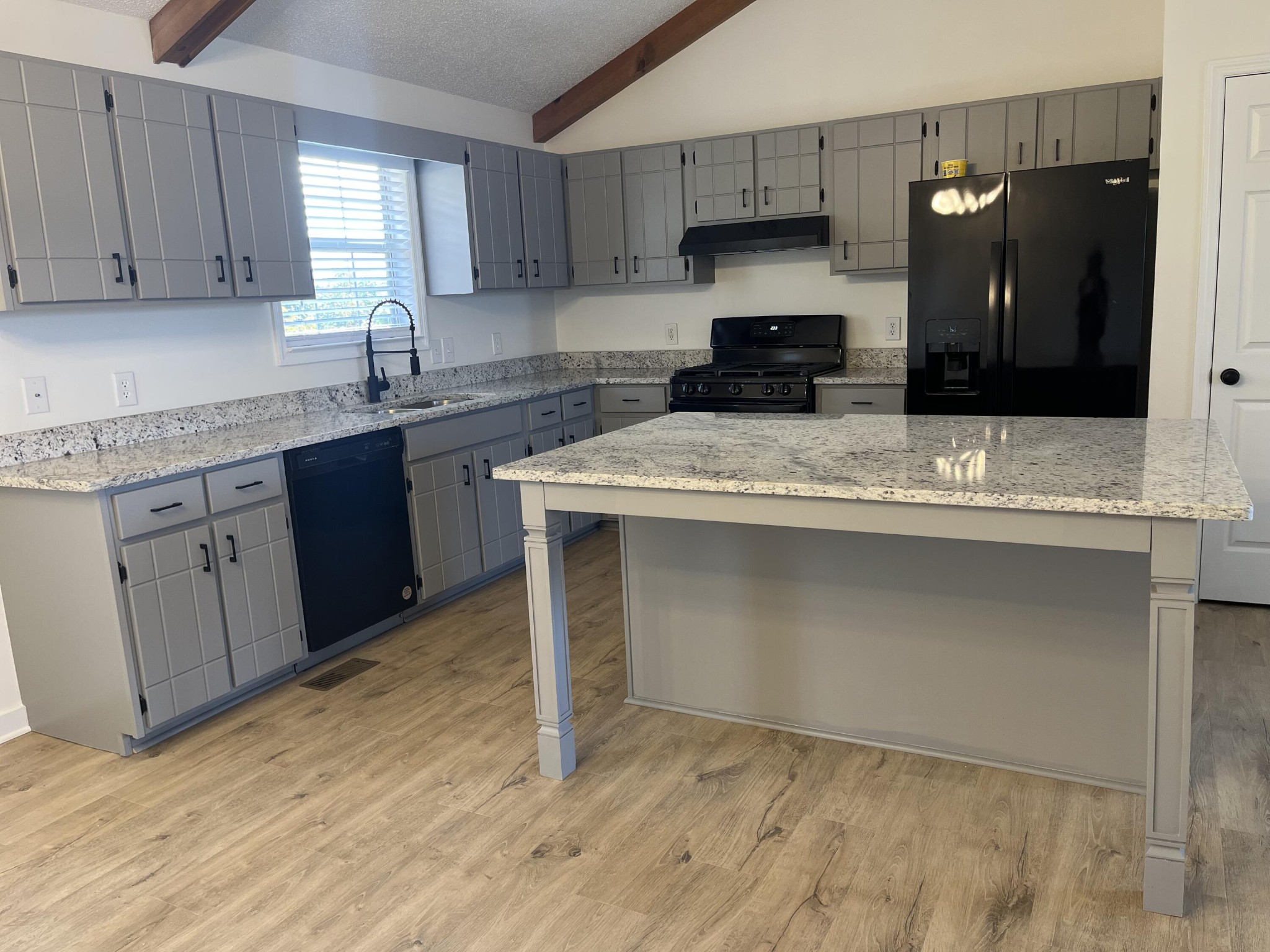 2824 Bent Oak Road Chattanooga, TN 37421 - Photo 2 of 15 a kitchen with stainless steel appliances granite countertop a stove a sink and a refrigerator