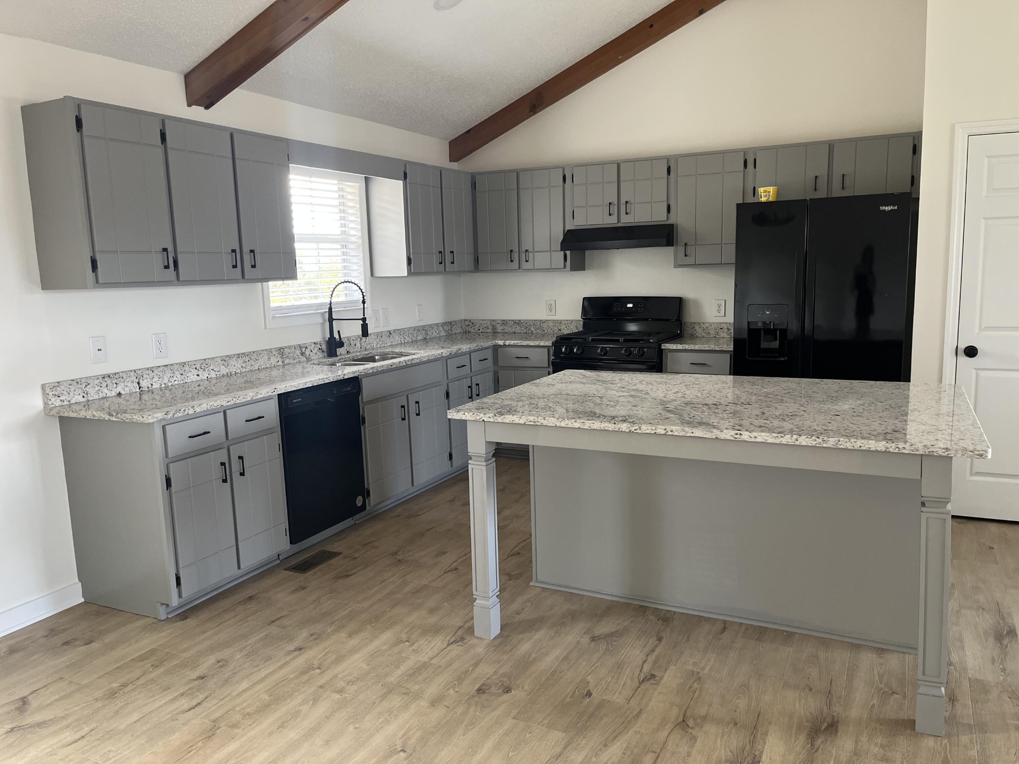 2824 Bent Oak Road Chattanooga, TN 37421 - Photo 3 of 15 a kitchen with a sink a stove a refrigerator and cabinets