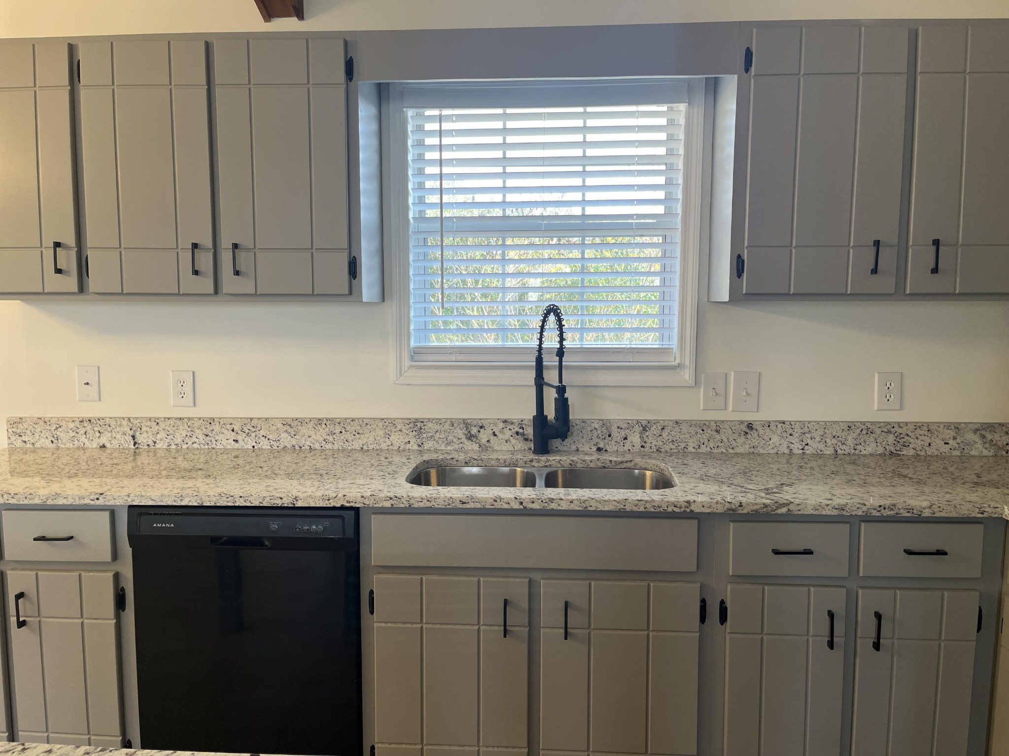 2824 Bent Oak Road Chattanooga, TN 37421 - Photo 4 of 15 a kitchen with granite countertop a sink window and cabinets