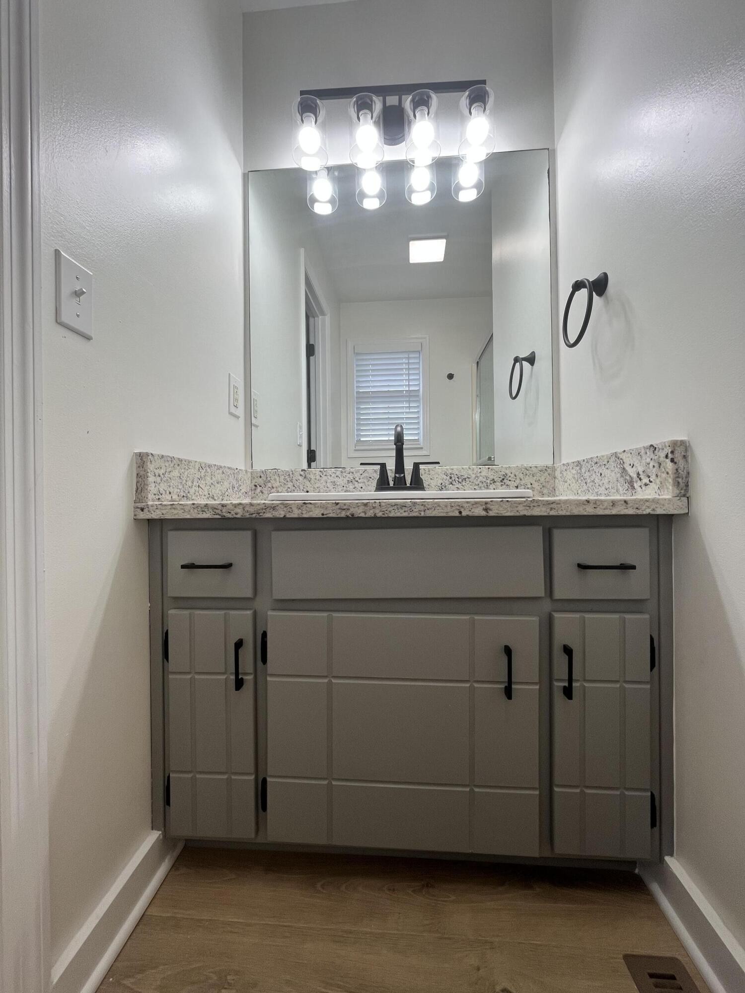 2824 Bent Oak Road Chattanooga, TN 37421 - Photo 7 of 15 a bathroom with a granite countertop sink and a mirror