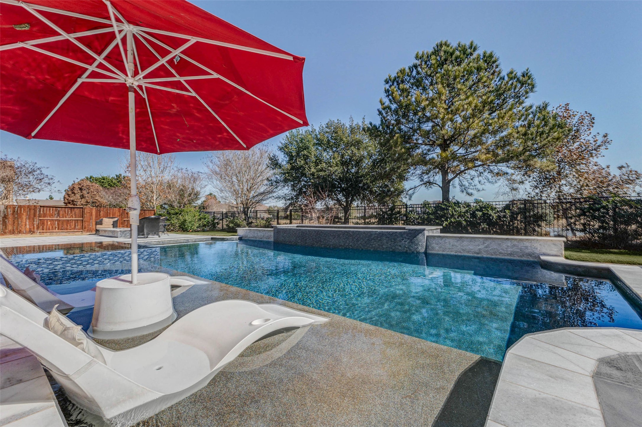 a view of a backyard with sitting area