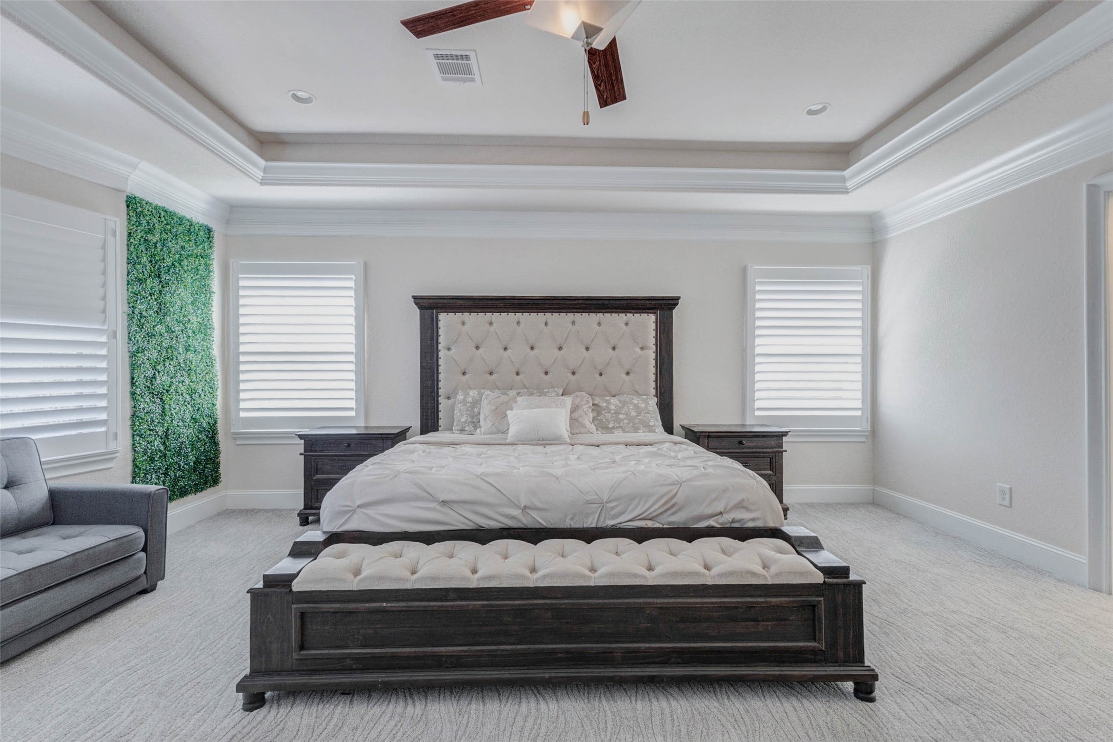 2310 Legends Way Katy, TX 77493 - Photo 24 of 50 a large bed sitting in a bedroom next to a window and a couch