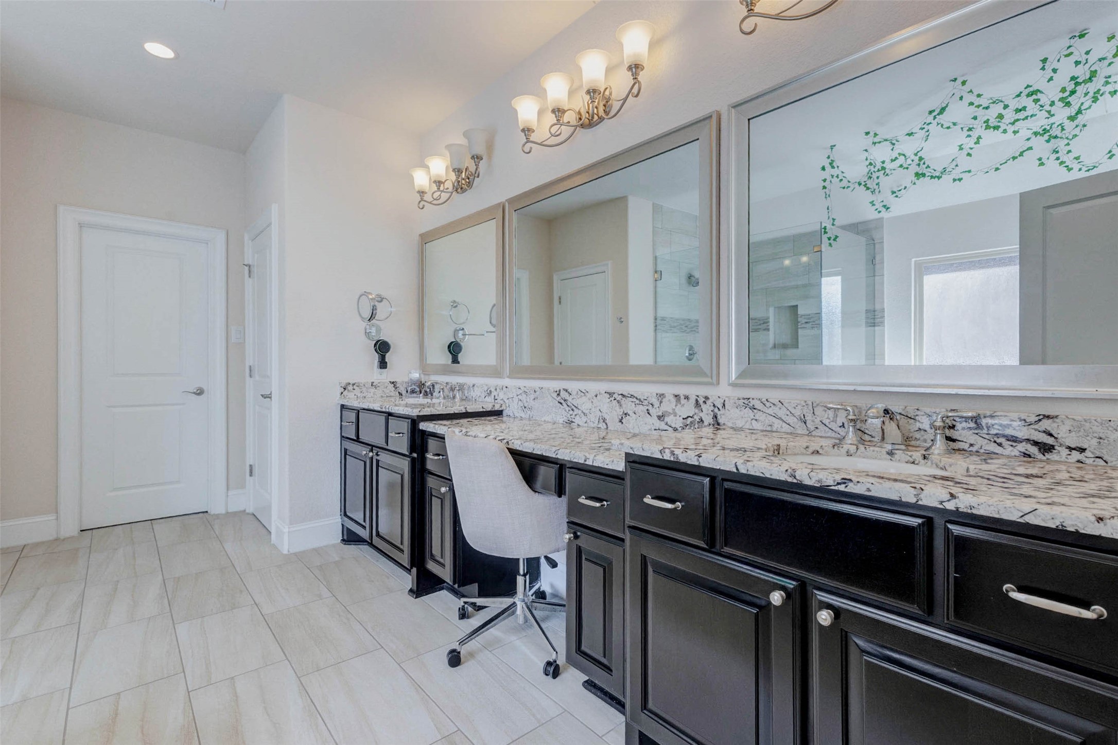 2310 Legends Way Katy, TX 77493 - Photo 25 of 50 a bathroom with a sink and a mirror