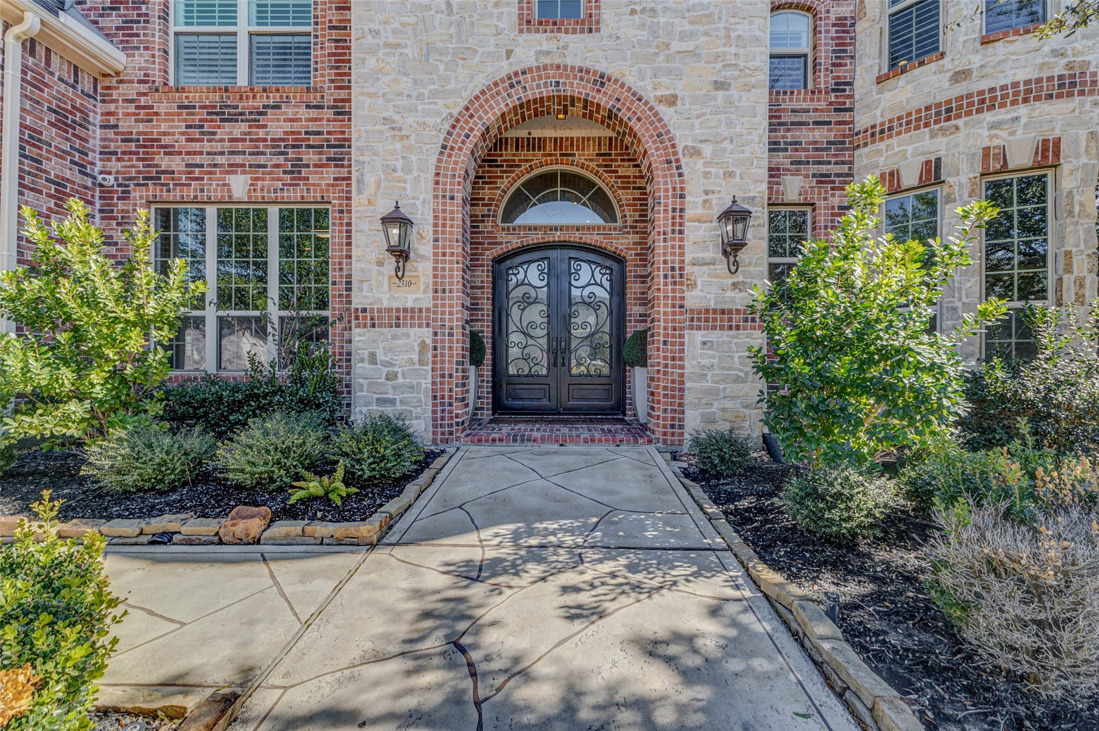 2310 Legends Way Katy, TX 77493 - Photo 5 of 50 a view of a brick house with plants