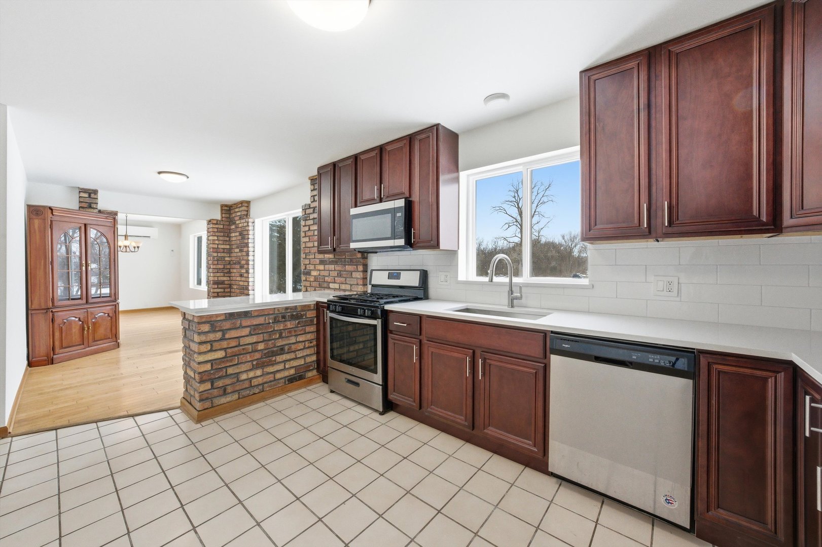 21122 Hillside Road Frankfort, IL 60423 - Photo 12 of 48 a kitchen with stainless steel appliances granite countertop a stove a sink and a microwave
