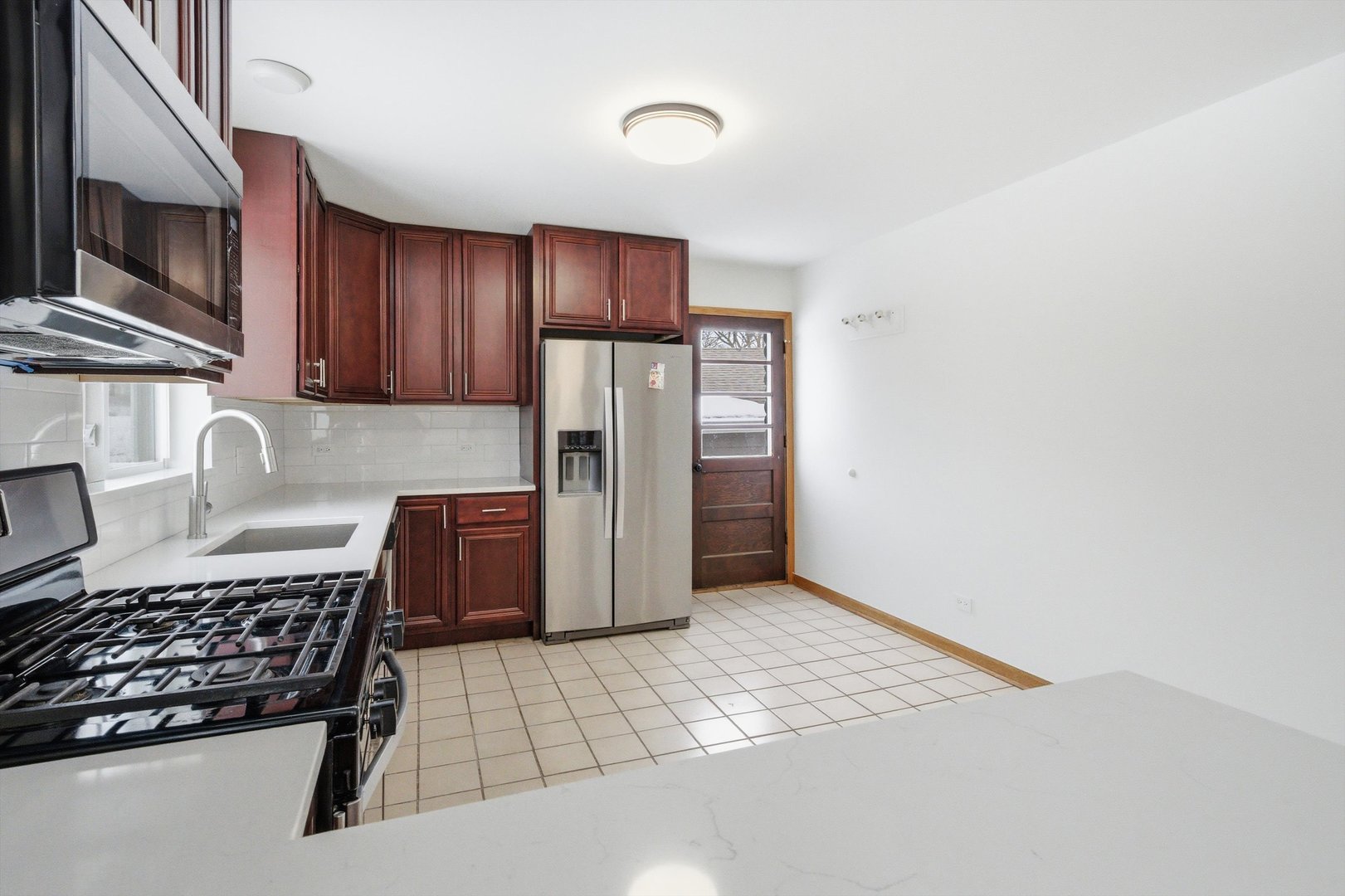 21122 Hillside Road Frankfort, IL 60423 - Photo 13 of 48 a kitchen with a refrigerator and a stove top oven