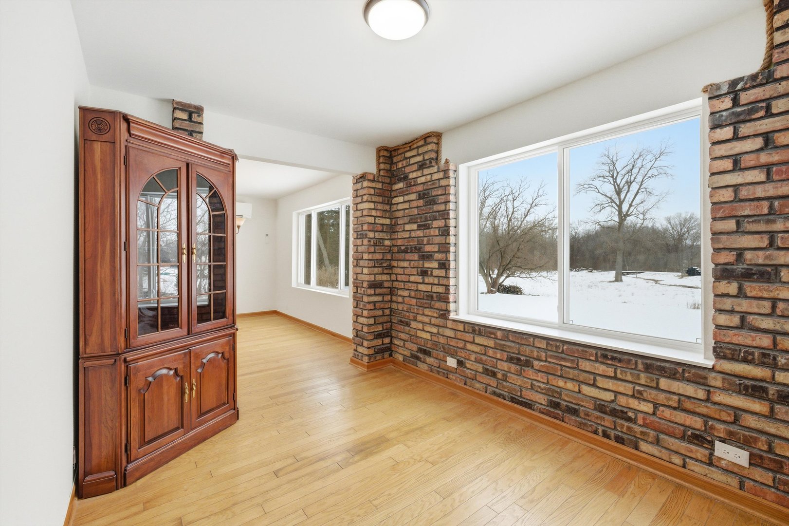 21122 Hillside Road Frankfort, IL 60423 - Photo 17 of 48 a view of a hallway with wooden floor and a living room
