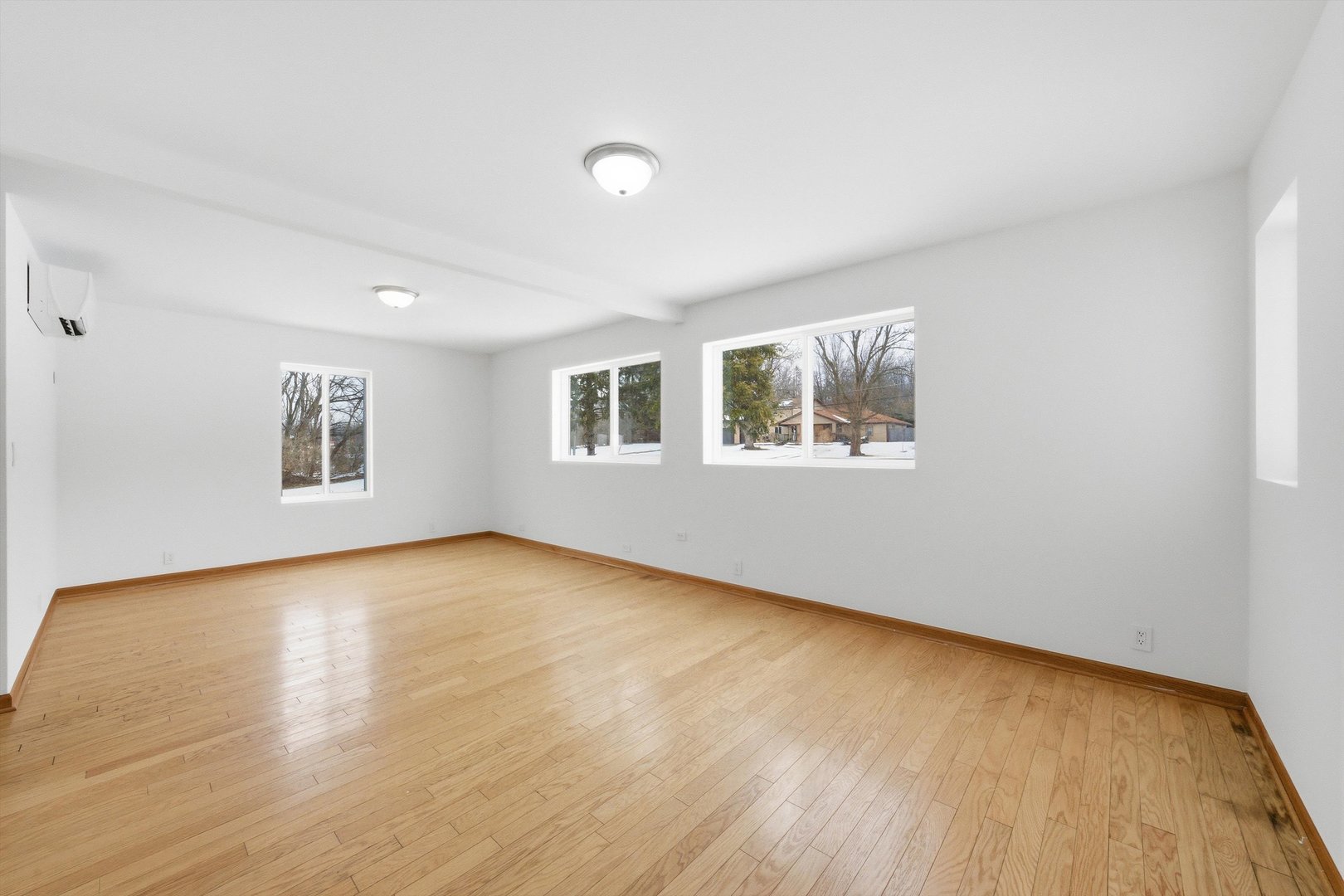 21122 Hillside Road Frankfort, IL 60423 - Photo 18 of 48 a view of an empty room with window and wooden floor