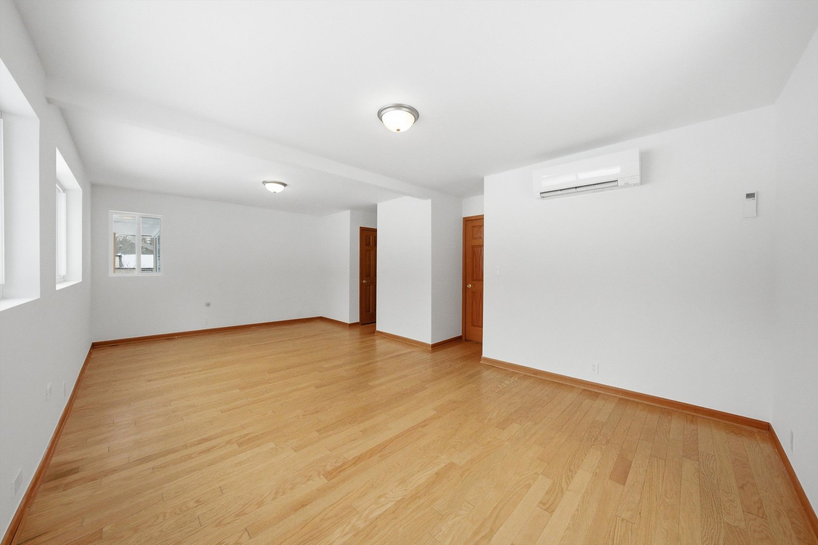 21122 Hillside Road Frankfort, IL 60423 - Photo 20 of 48 a view of an empty room with wooden floor and a window