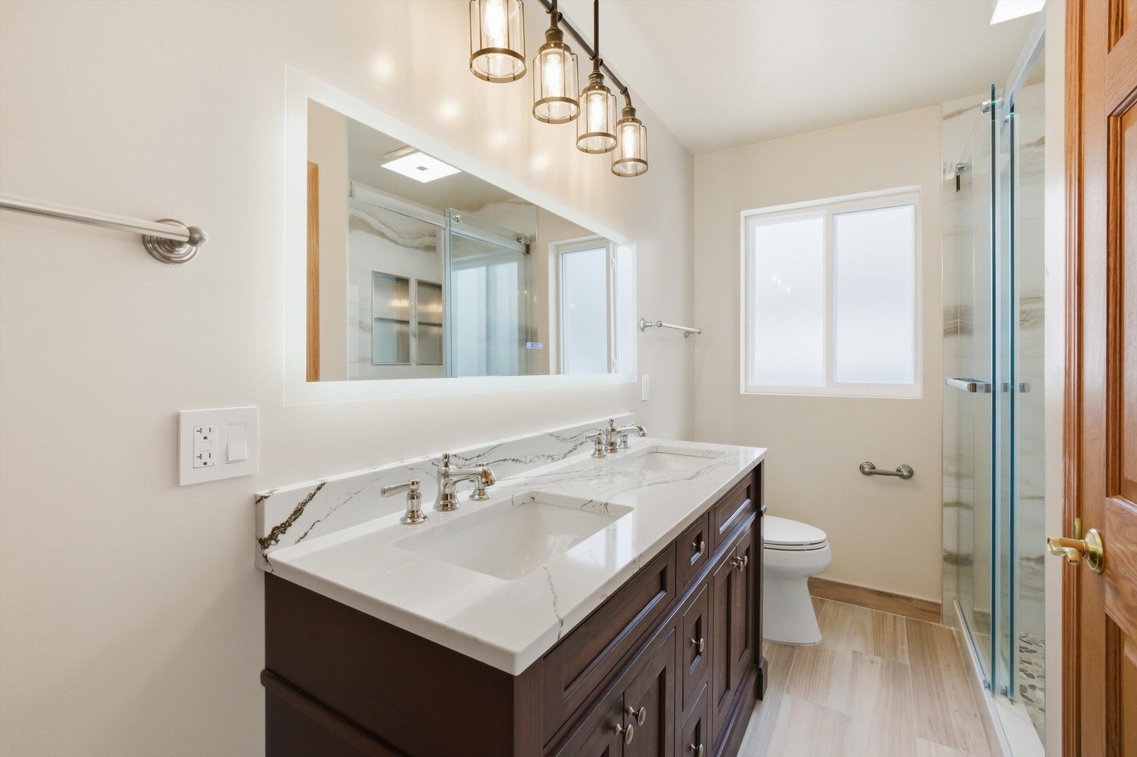 21122 Hillside Road Frankfort, IL 60423 - Photo 21 of 48 a bathroom with a sink a toilet a mirror and shower