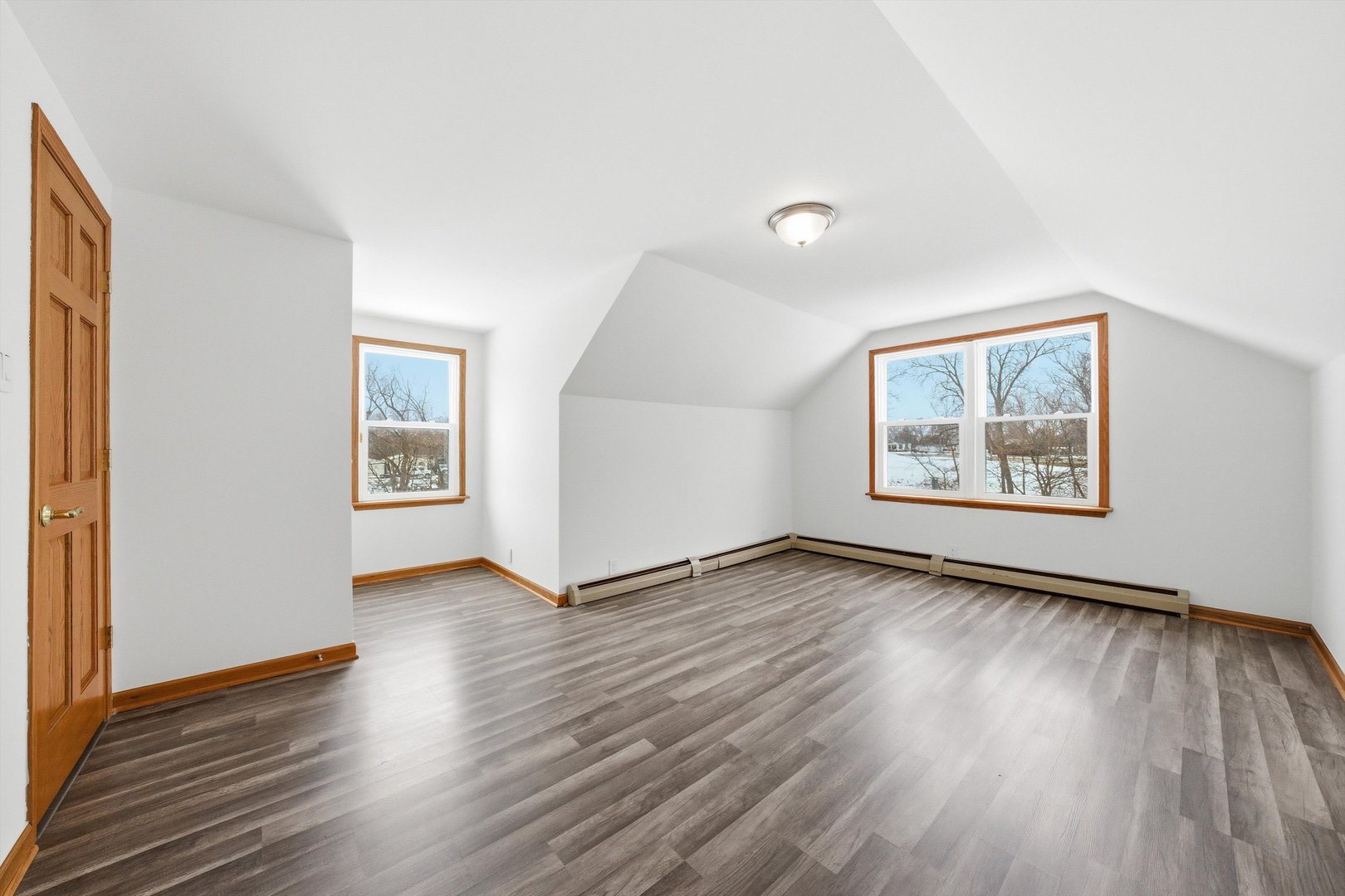 21122 Hillside Road Frankfort, IL 60423 - Photo 23 of 48 an empty room with wooden floor and windows