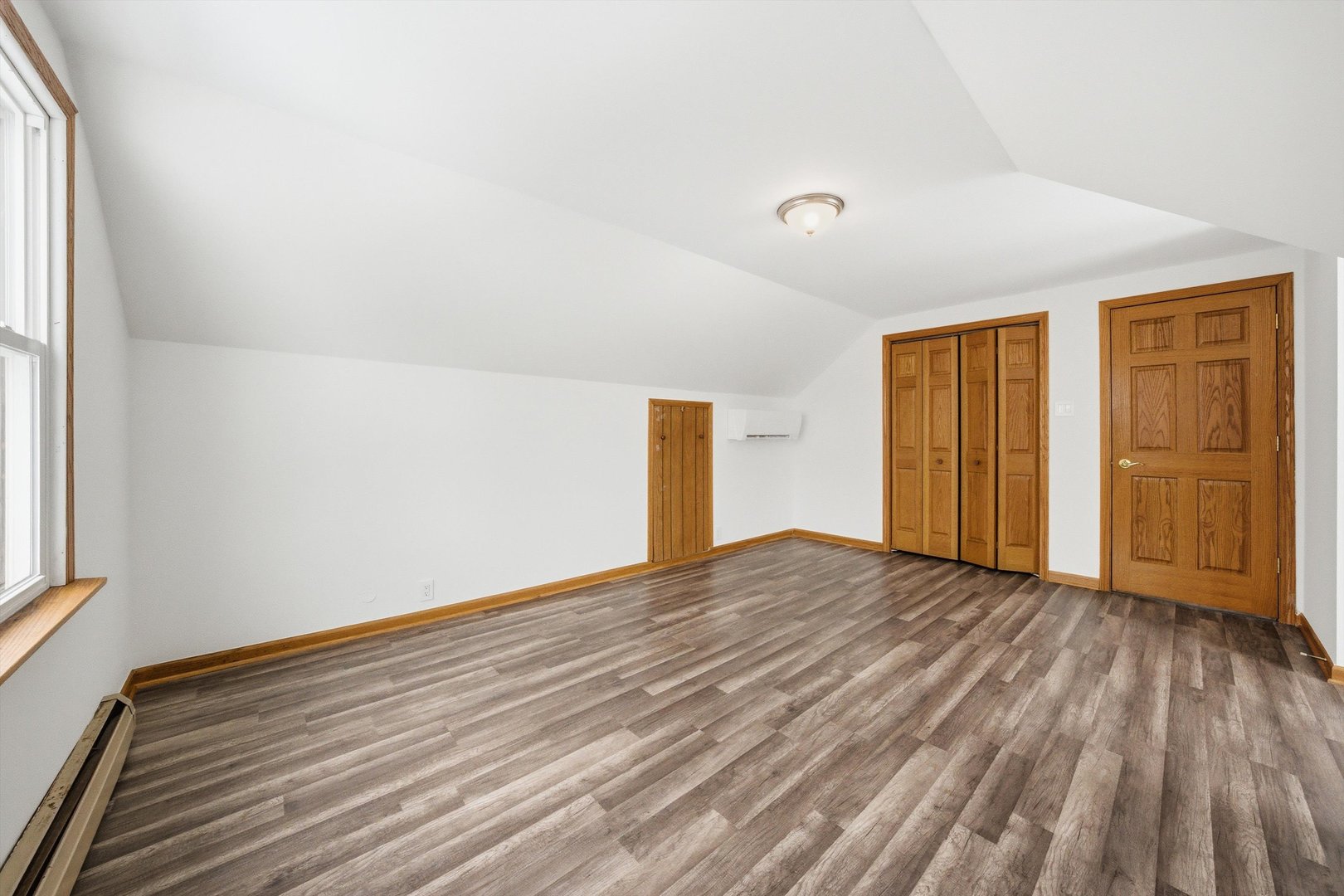 21122 Hillside Road Frankfort, IL 60423 - Photo 26 of 48 a view of an empty room with wooden floor and a window