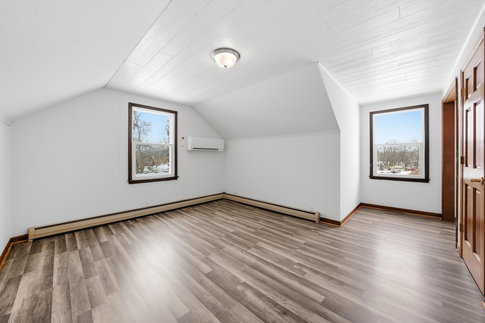 21122 Hillside Road Frankfort, IL 60423 - Photo 27 of 48 a view of an empty room with wooden floor and a window