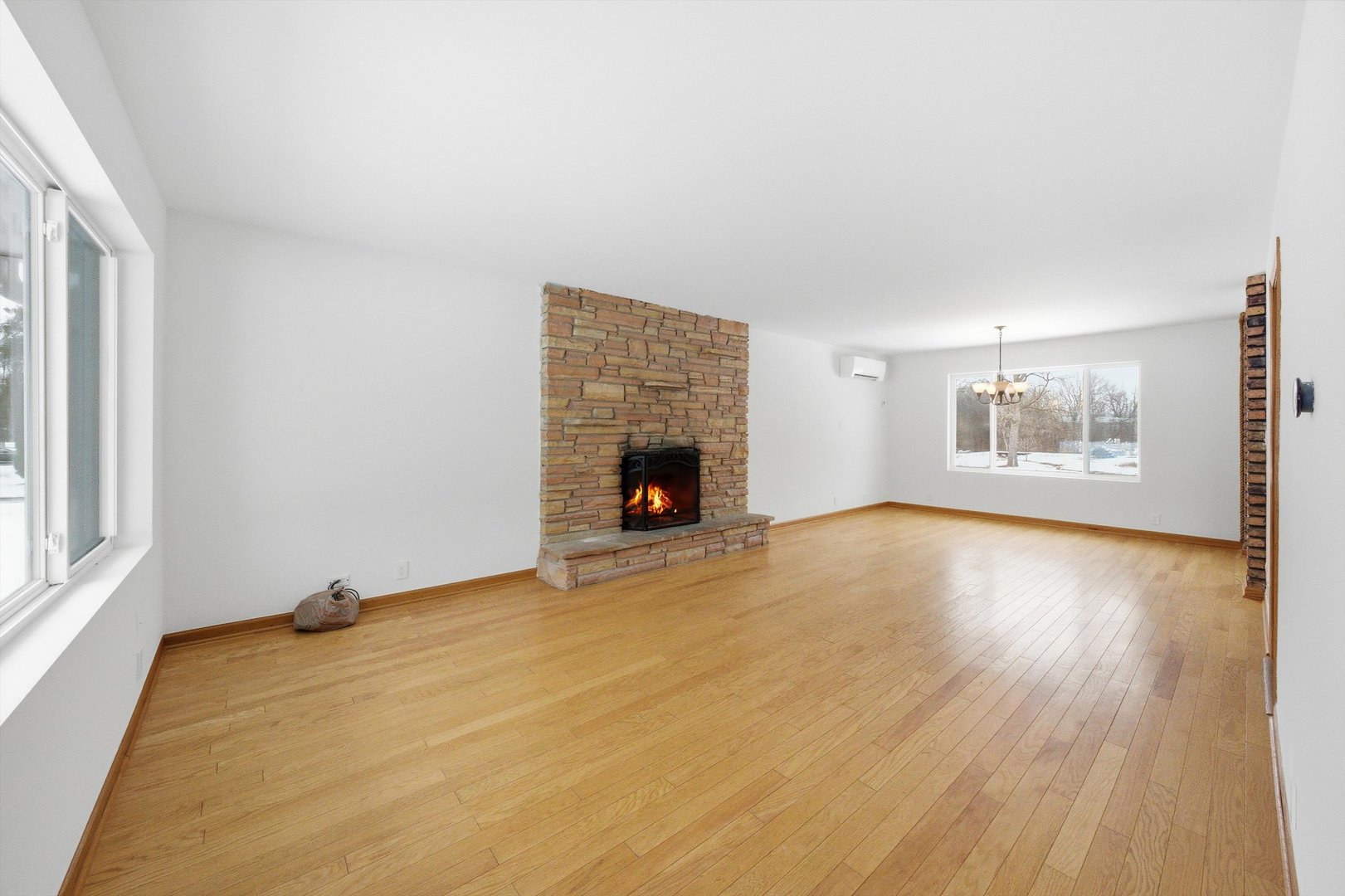 21122 Hillside Road Frankfort, IL 60423 - Photo 7 of 48 a view of an empty room with a window and fireplace