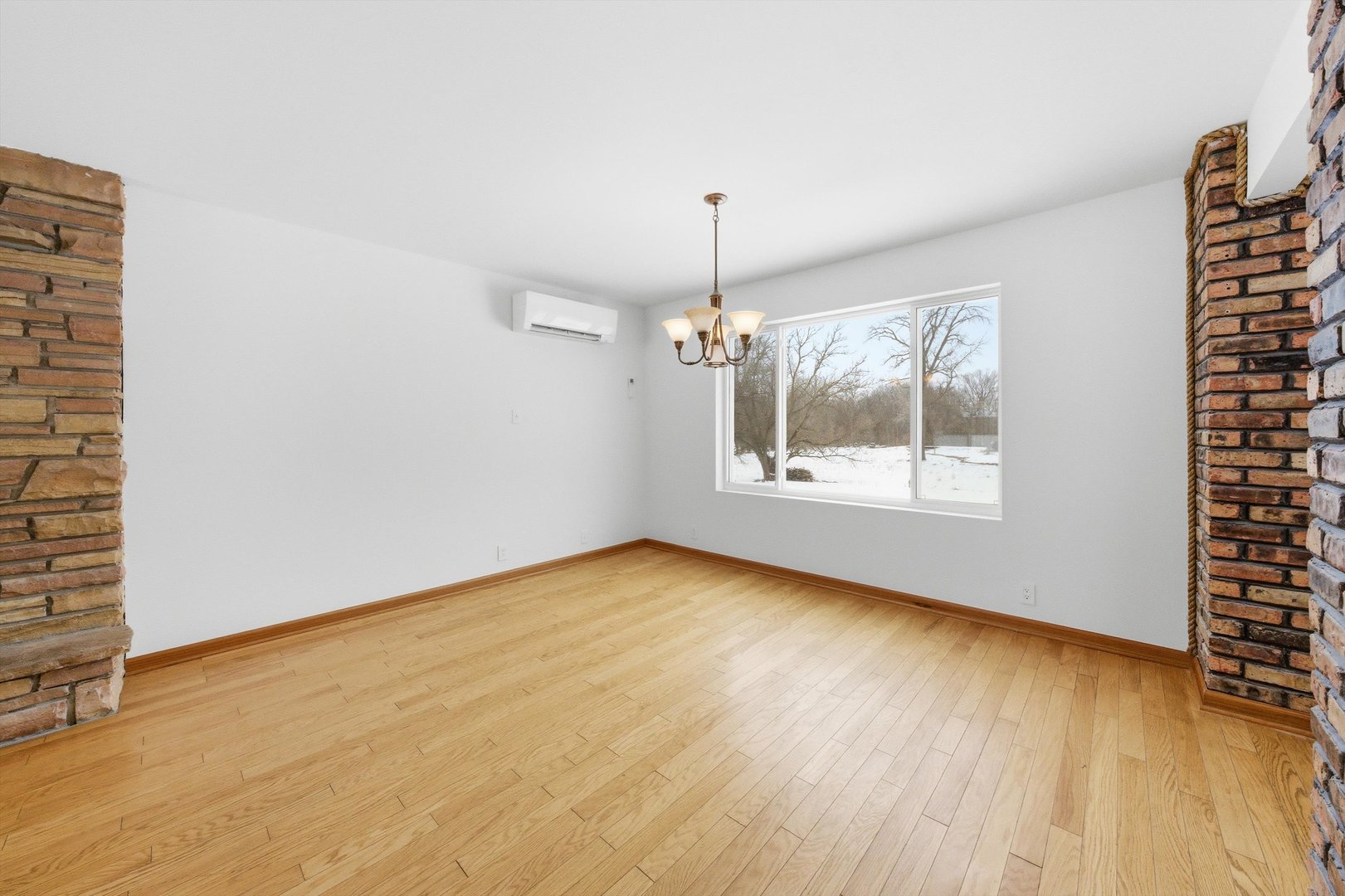 21122 Hillside Road Frankfort, IL 60423 - Photo 9 of 48 wooden floor in an empty room with a window