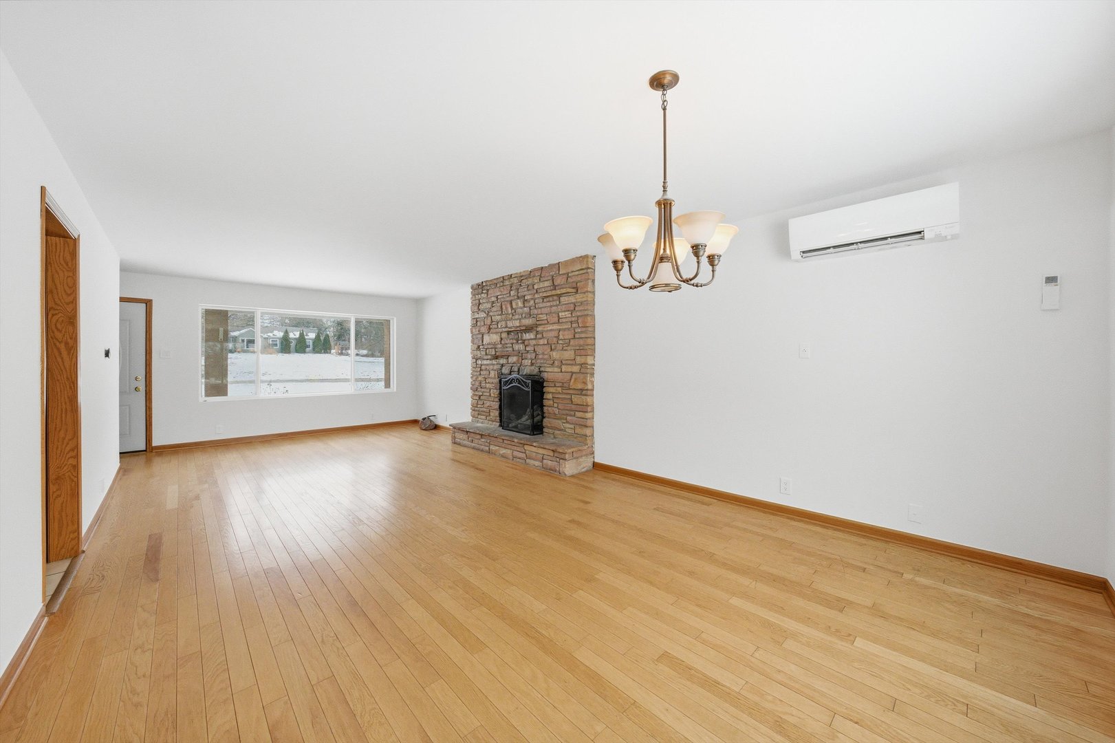 21122 Hillside Road Frankfort, IL 60423 - Photo 10 of 48 a view of a room with wooden floor fireplace and window