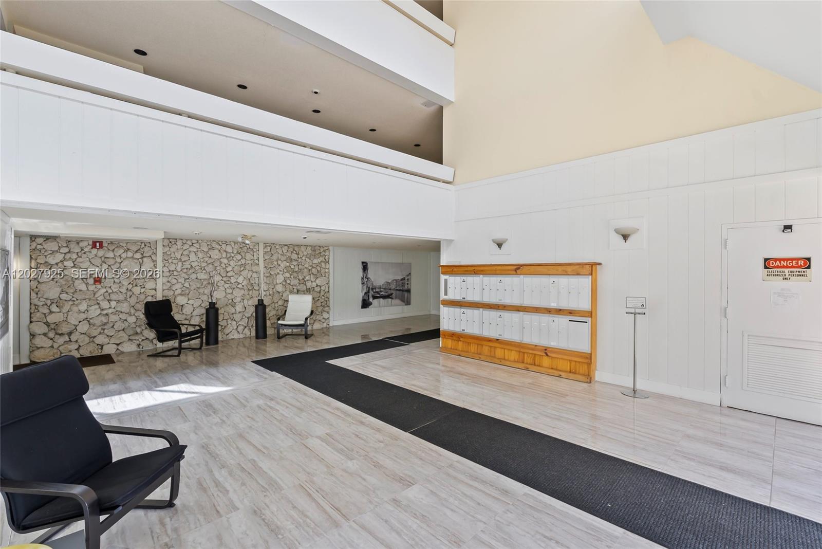 301 Racquet Club Road, Unit 103 Weston, FL 33326 - Photo 3 of 20 a living room with furniture and a fireplace