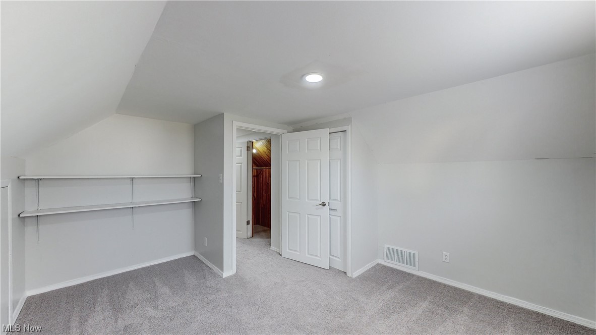 1466 Scenic Way Akron, OH 44310 - Photo 23 of 35 Bonus room with light colored carpet and vaulted ceiling