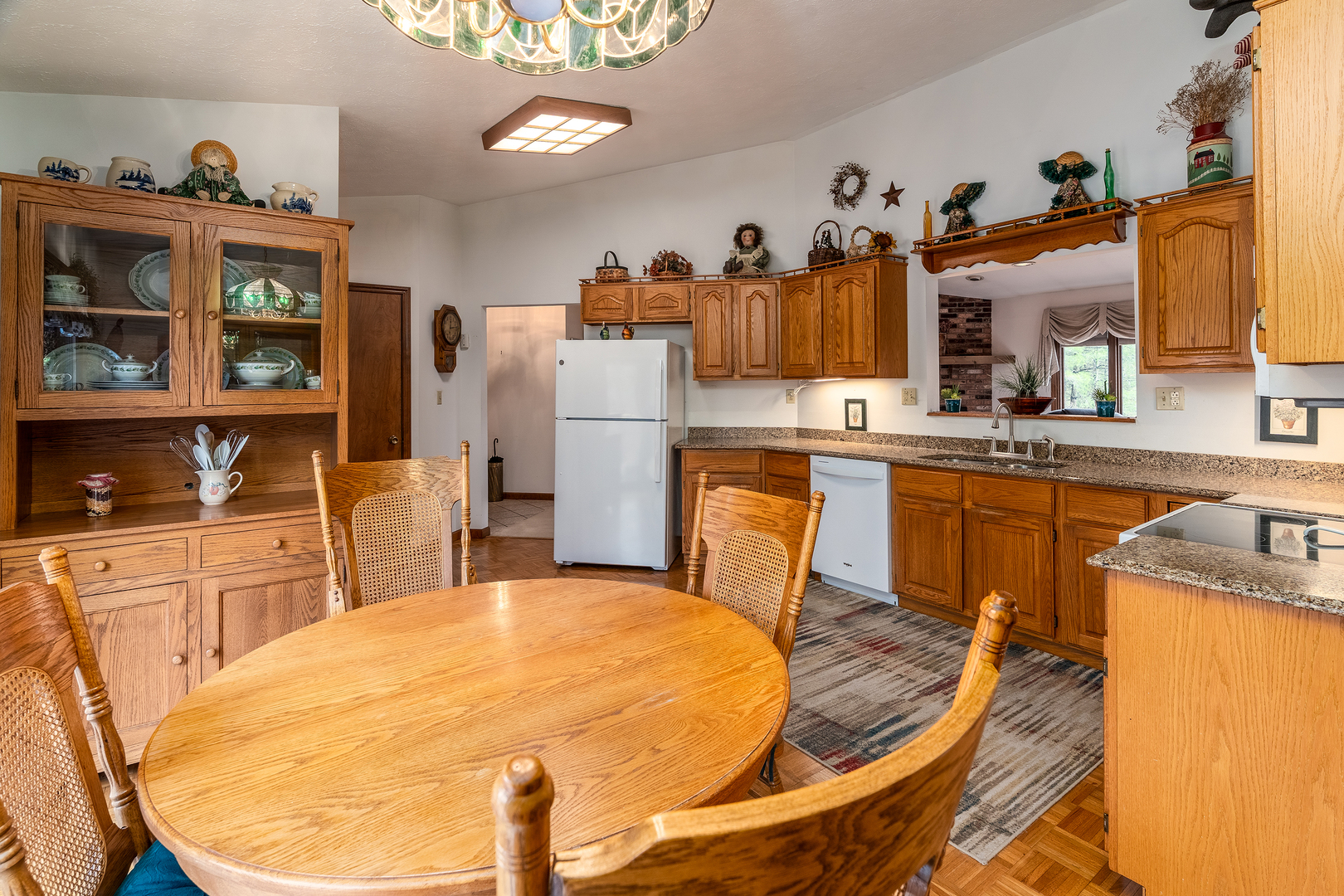 3085 Kaolin Road Cobden, IL 62920 - Photo 11 of 83 a kitchen with stainless steel appliances kitchen island granite countertop a sink and cabinets