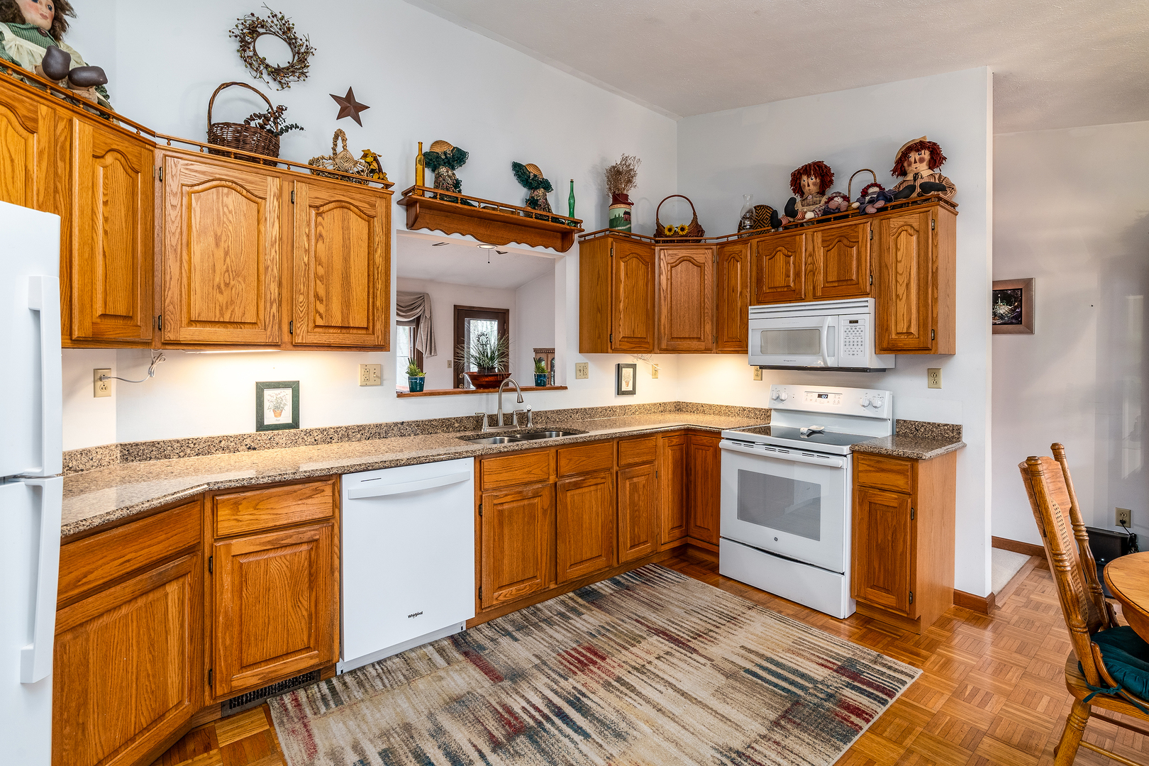 3085 Kaolin Road Cobden, IL 62920 - Photo 12 of 83 a kitchen with stainless steel appliances granite countertop a stove a sink and a microwave