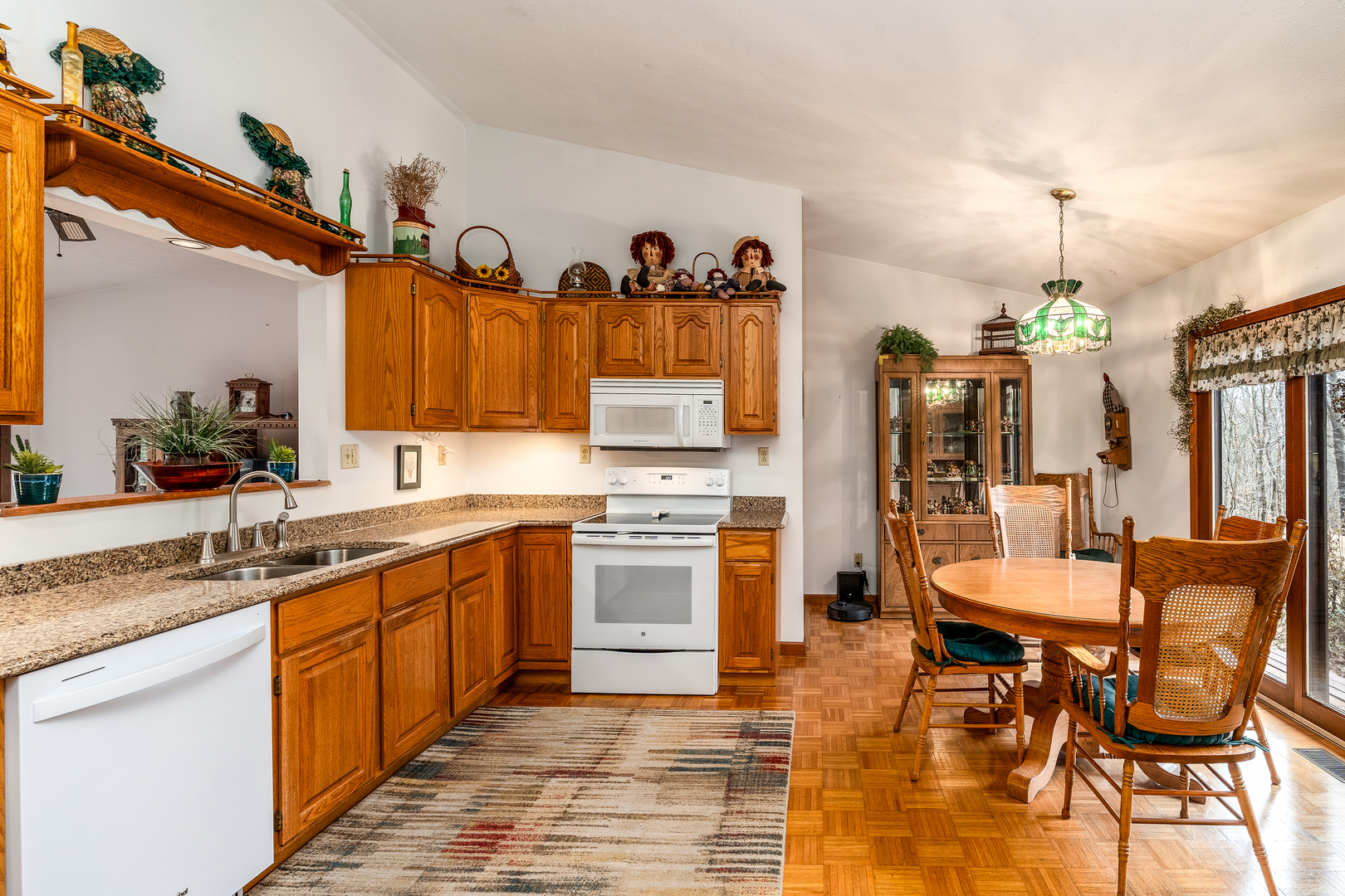 3085 Kaolin Road Cobden, IL 62920 - Photo 13 of 83 a kitchen with stainless steel appliances granite countertop a sink and a refrigerator