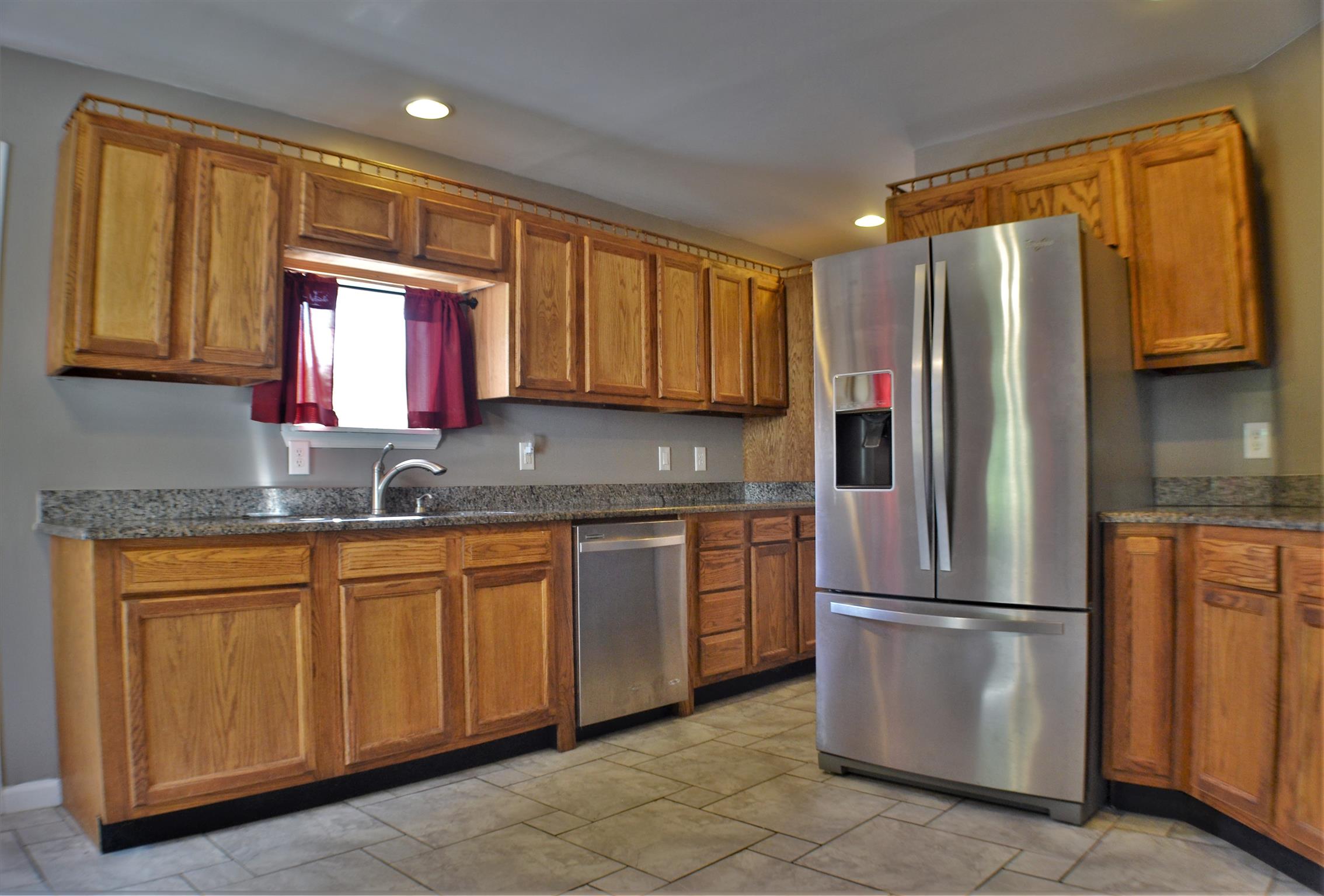 1184 Iron Bridge Road Columbia, TN 38401 - Photo 13 of 30 a kitchen with stainless steel appliances granite countertop a refrigerator and a sink