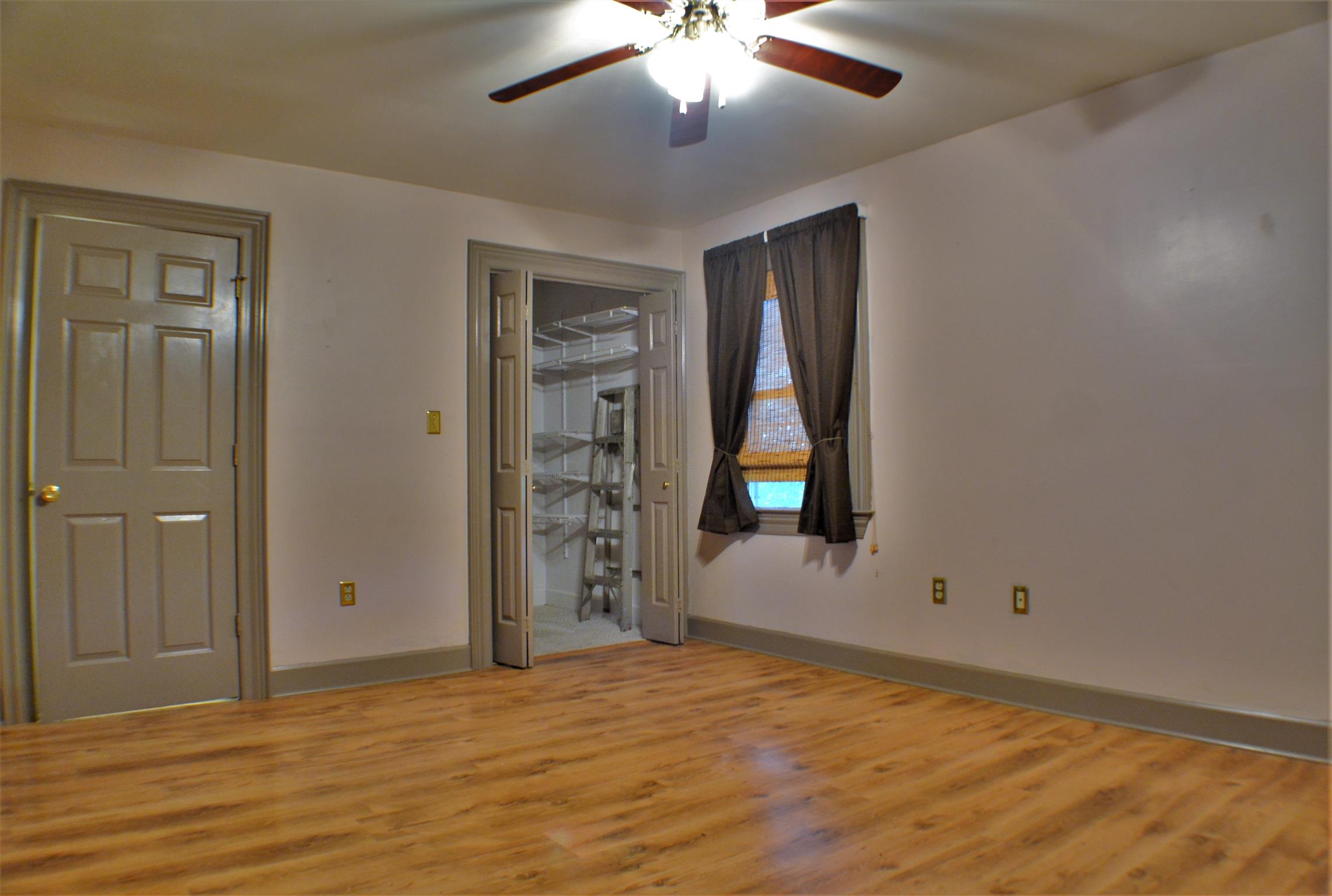 1184 Iron Bridge Road Columbia, TN 38401 - Photo 23 of 30 wooden floor and window in an empty room