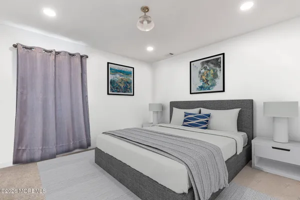 a bedroom with bed and a window
