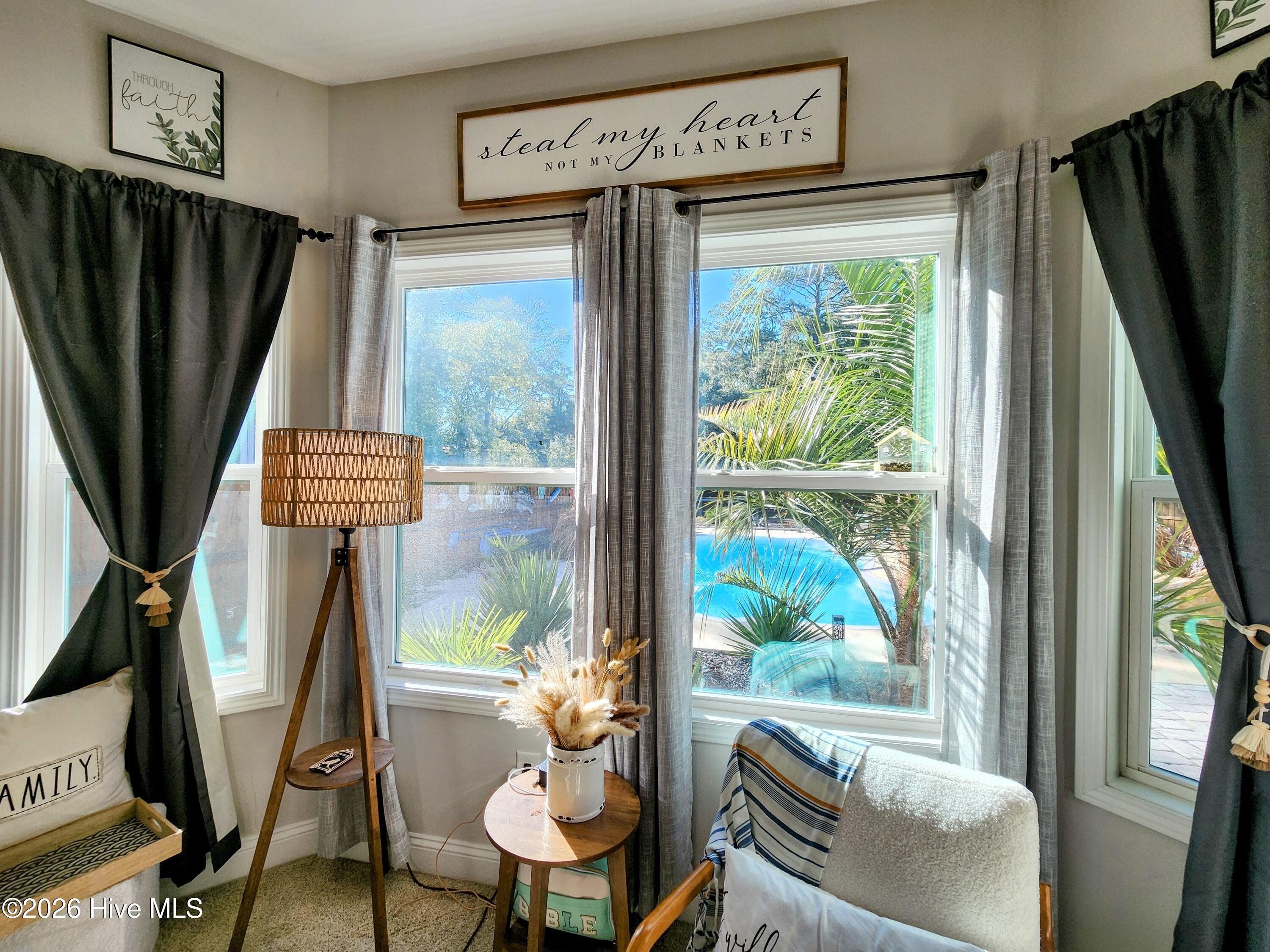 1133 Spincast Road Southport, NC 28461 - Photo 17 of 64 Primary Suite Overlooks Backyard Oasis