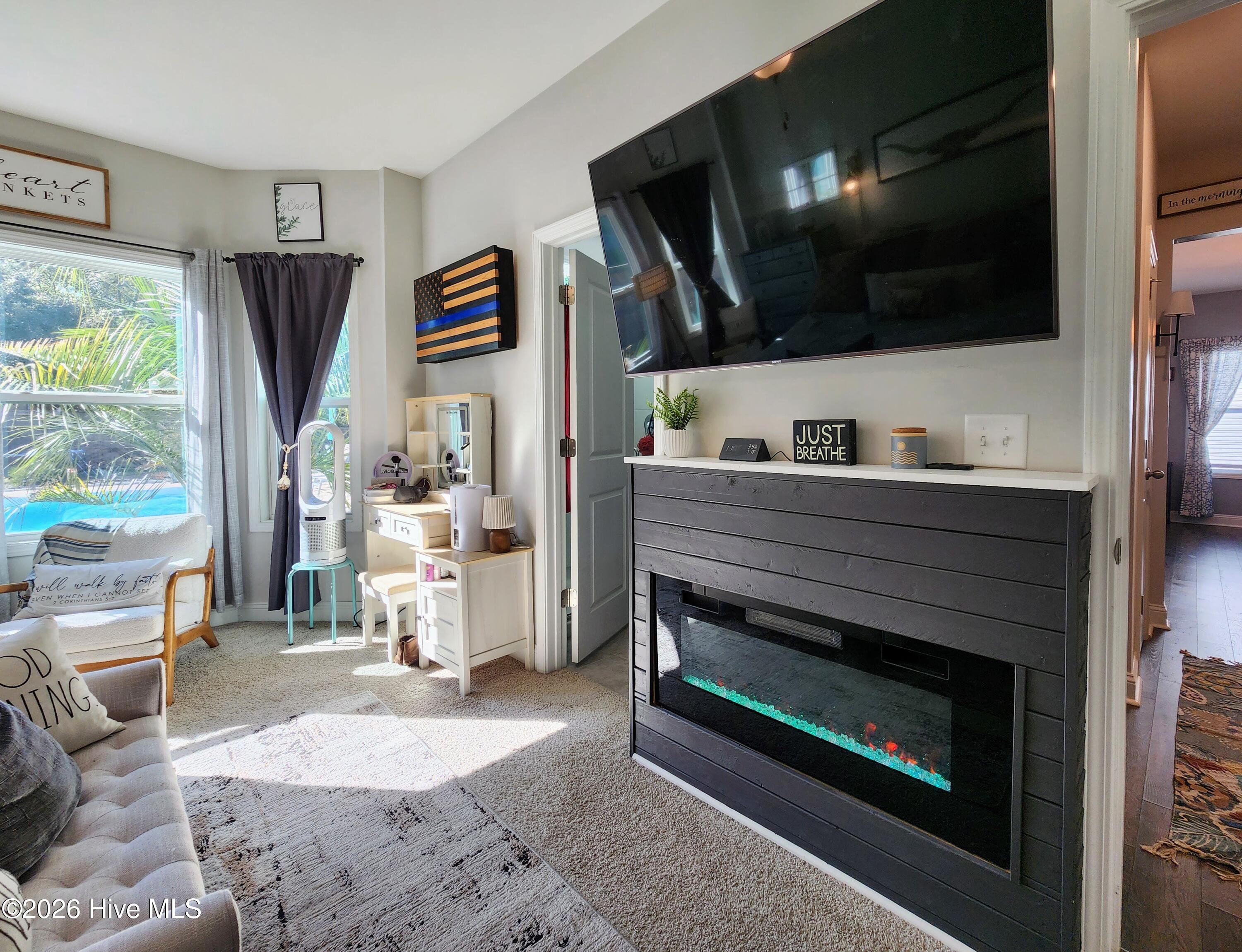 1133 Spincast Road Southport, NC 28461 - Photo 29 of 64 Primary Suite Fireplace