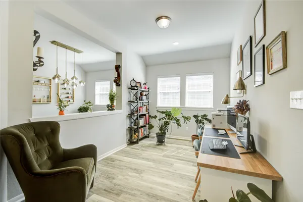 a living room with furniture or couch and a wooden floor