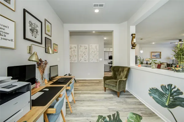 a living room with furniture and a table