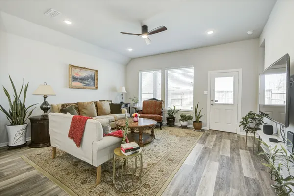 a living room with furniture or window and a wooden floor