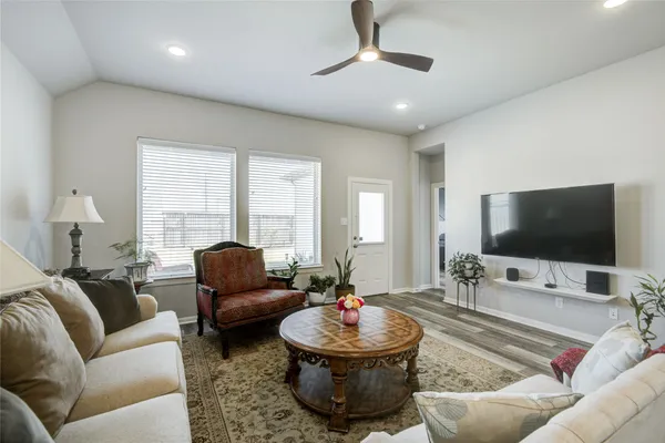 a living room with furniture and a flat screen tv