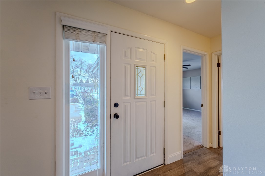 305 South Vandemark Road Sidney, OH 45365 - Photo 12 of 32 This inviting entrance features stylish flooring and ample natural light, creating a welcoming atmosphere.