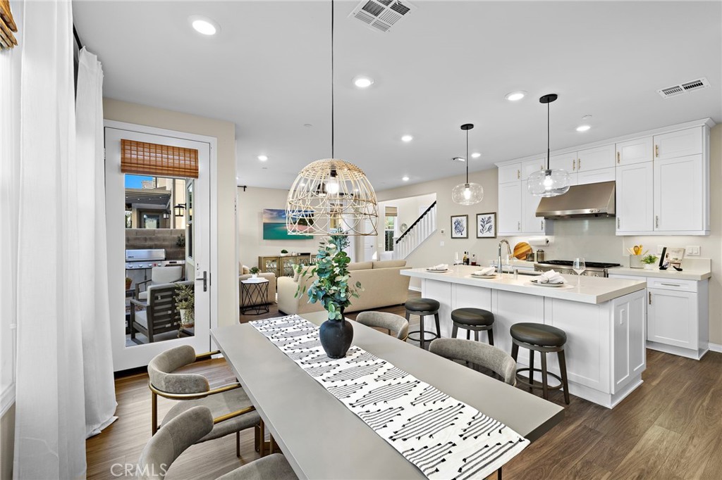 26 Paranza Place Rancho Mission Viejo, CA 92694 - Photo 3 of 65 a kitchen with a table and chairs in it