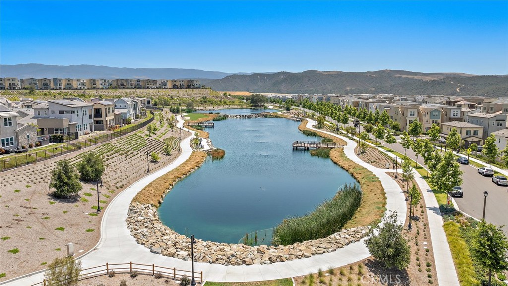 26 Paranza Place Rancho Mission Viejo, CA 92694 - Photo 61 of 65 a view of a swimming pool with a lake