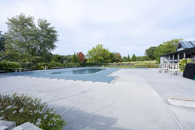 a view of a swimming pool with a patio