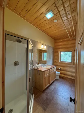 a kitchen with stainless steel appliances granite countertop a sink and a refrigerator
