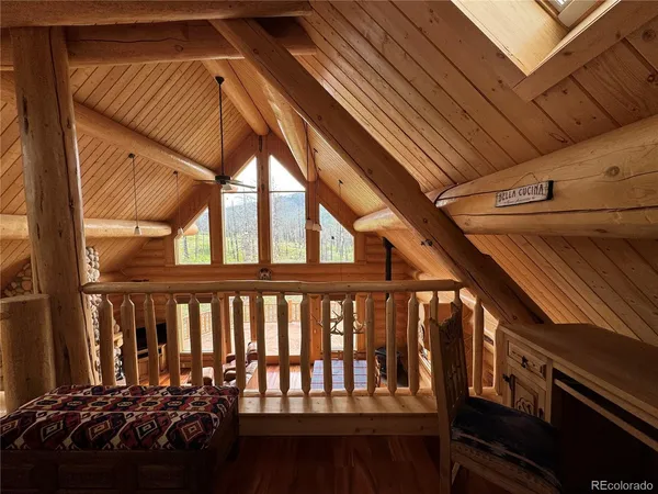 a view of a patio with table and chairs with wooden floor
